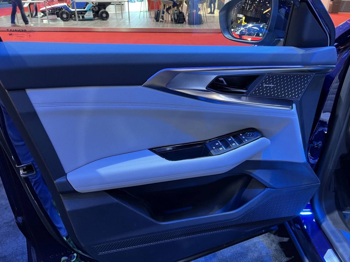 Interior door panel with Harman Kardon speaker and window controls