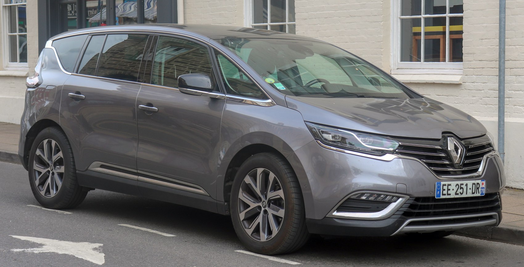 Minivan front and side profile with alloy wheels and modern grille