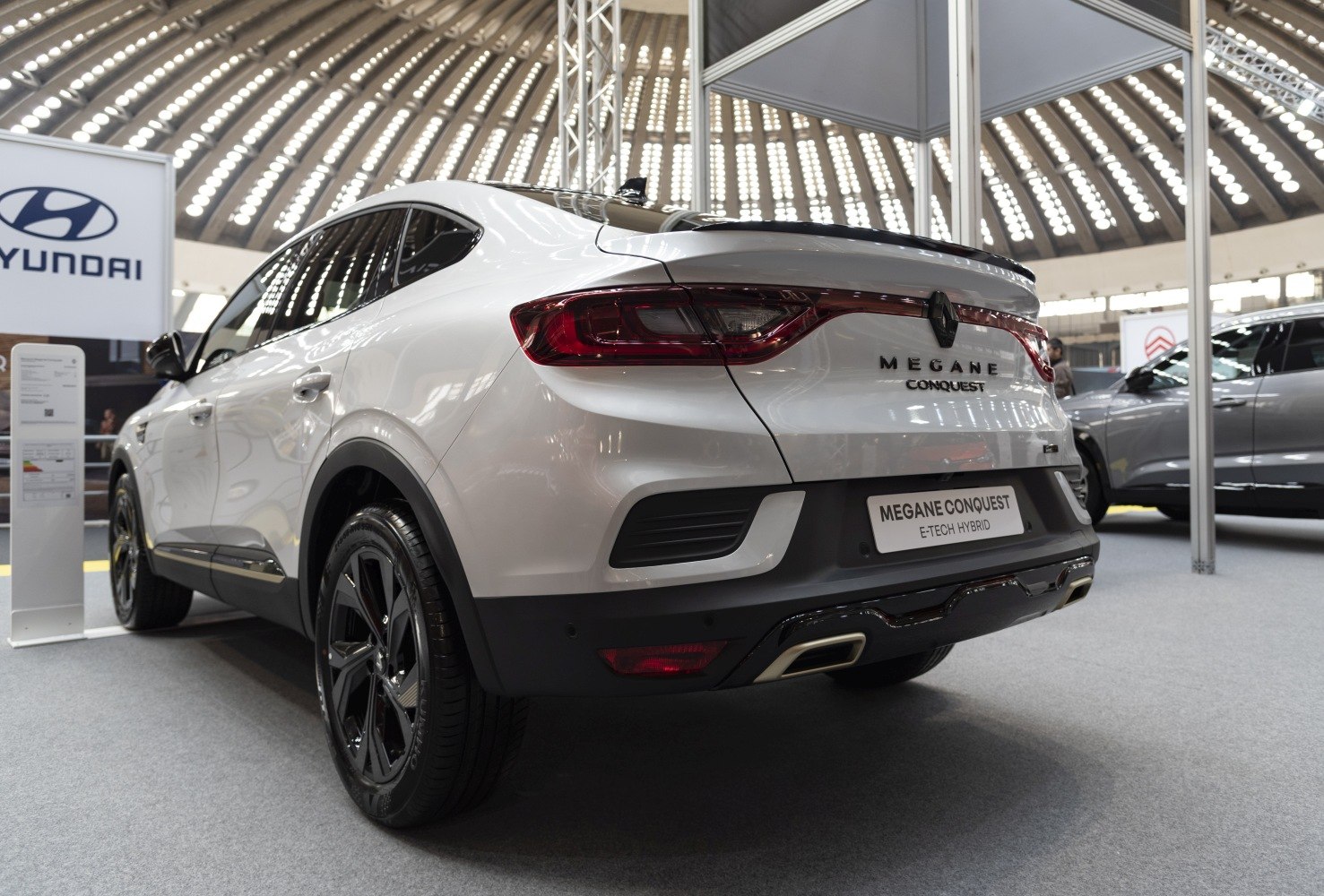 Sleek rear design with tail lights and dual exhaust