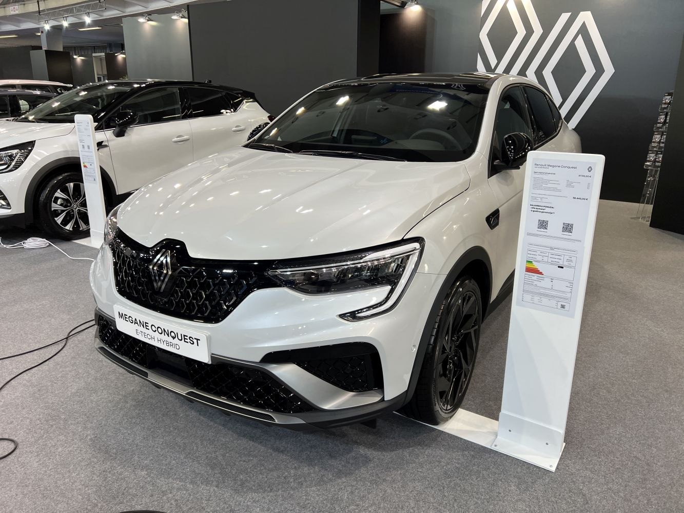 White crossover with black hexagonal grille and LED headlights