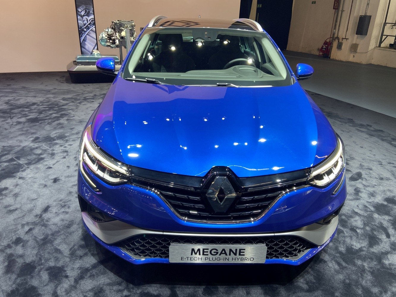 Blue car front with LED headlights and Renault grille