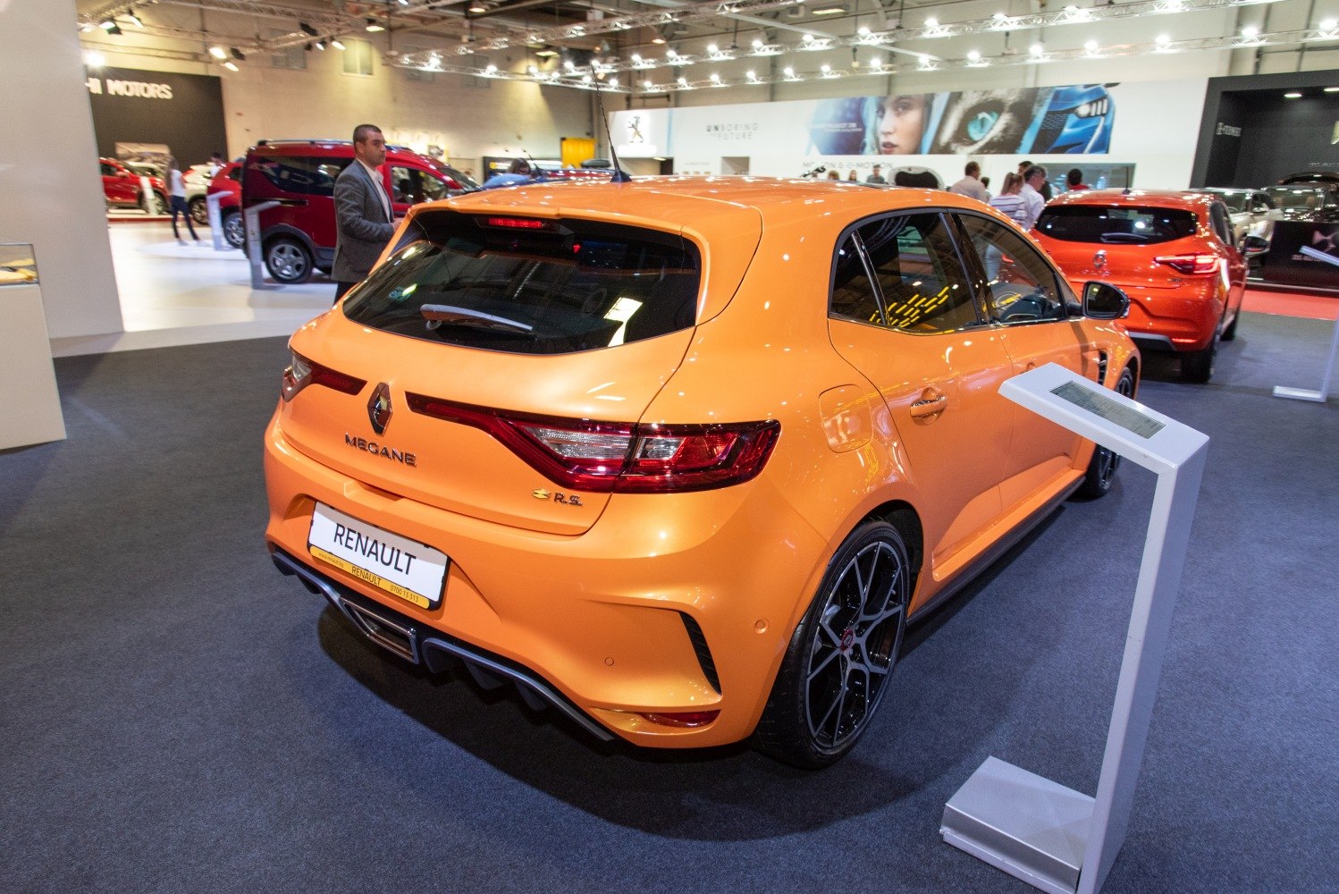 Rear perspective of sporty hatchback with LED taillights and diffuser