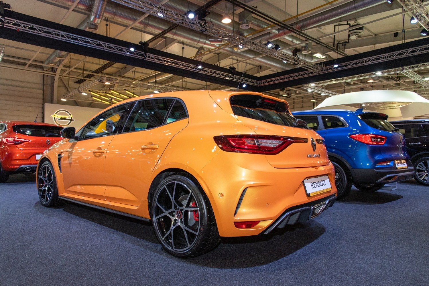 Sporty hatchback rear with black alloy wheels and diffuser