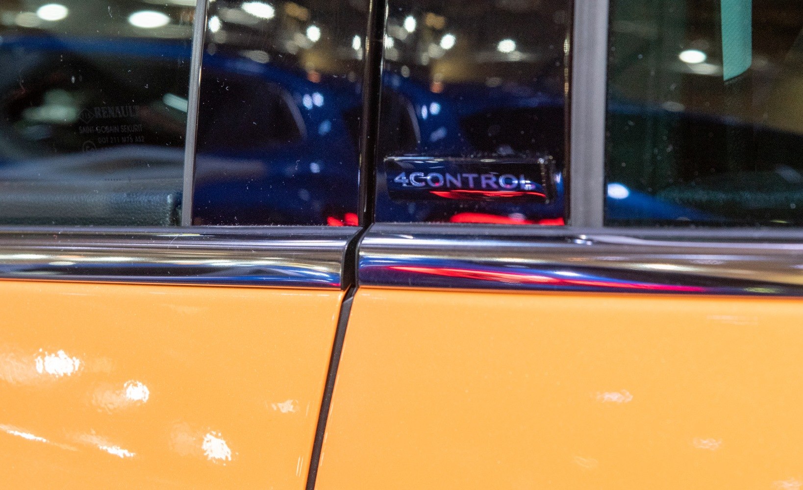 Close-up of 4CONTROL badge on door window frame