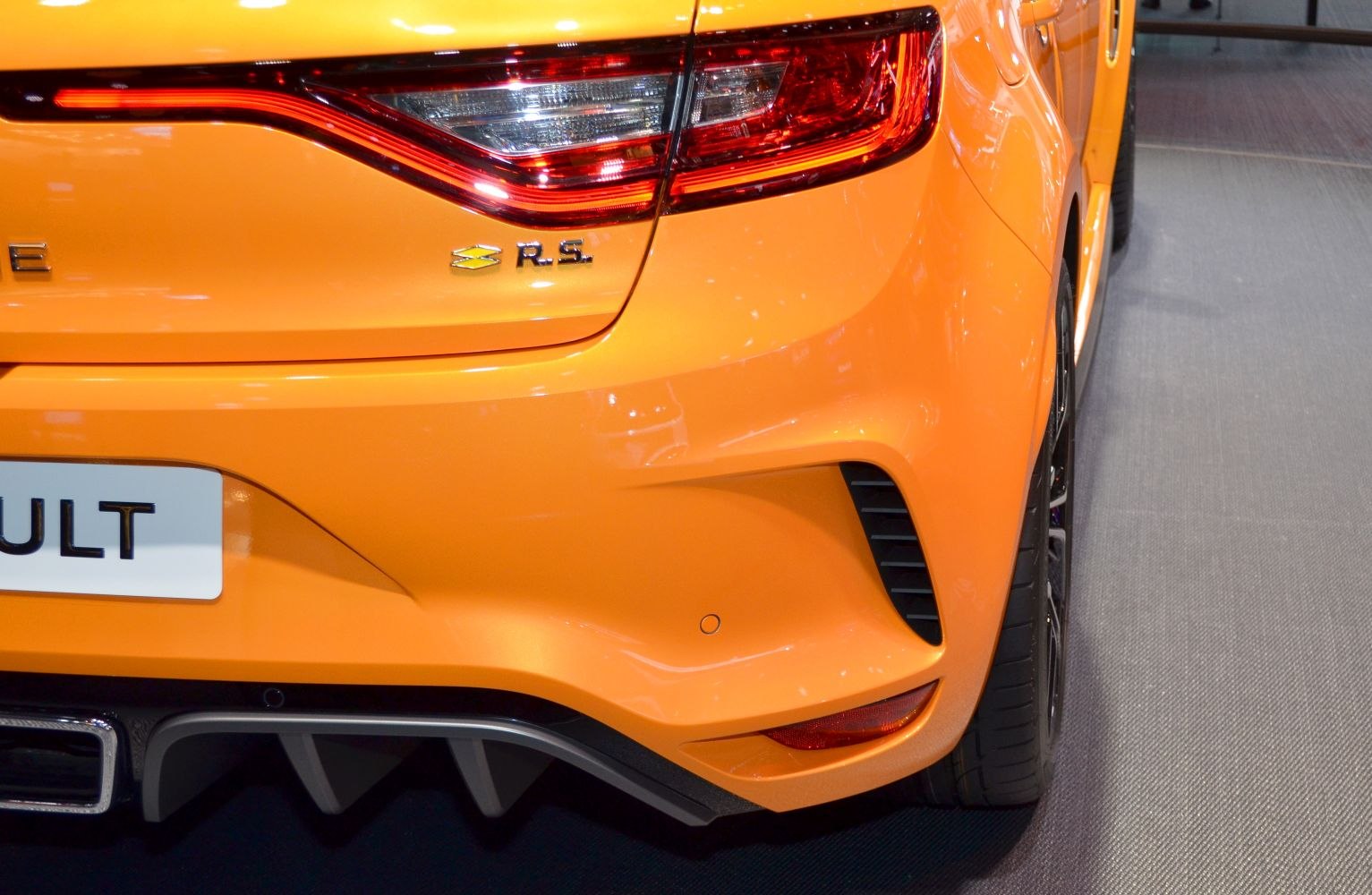 Sporty rear tail light and bumper with diffuser and air vent