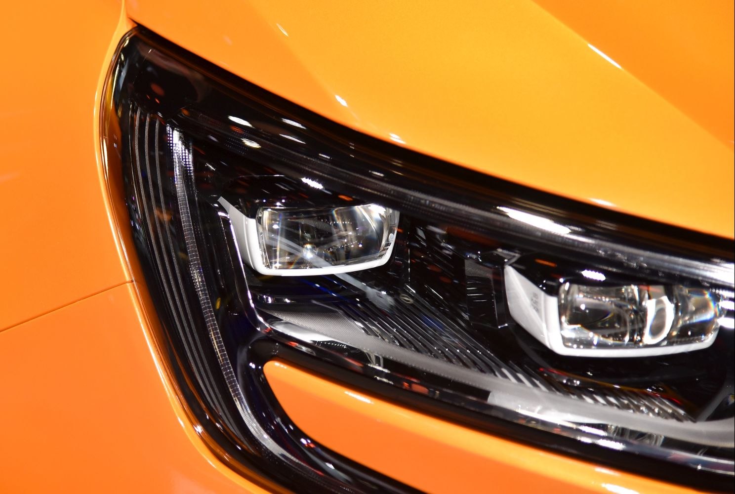 Close-up of modern car LED headlight with detailed lighting components