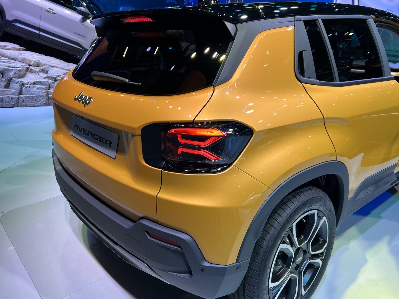 Rear view with distinctive tail light and sporty wheel design