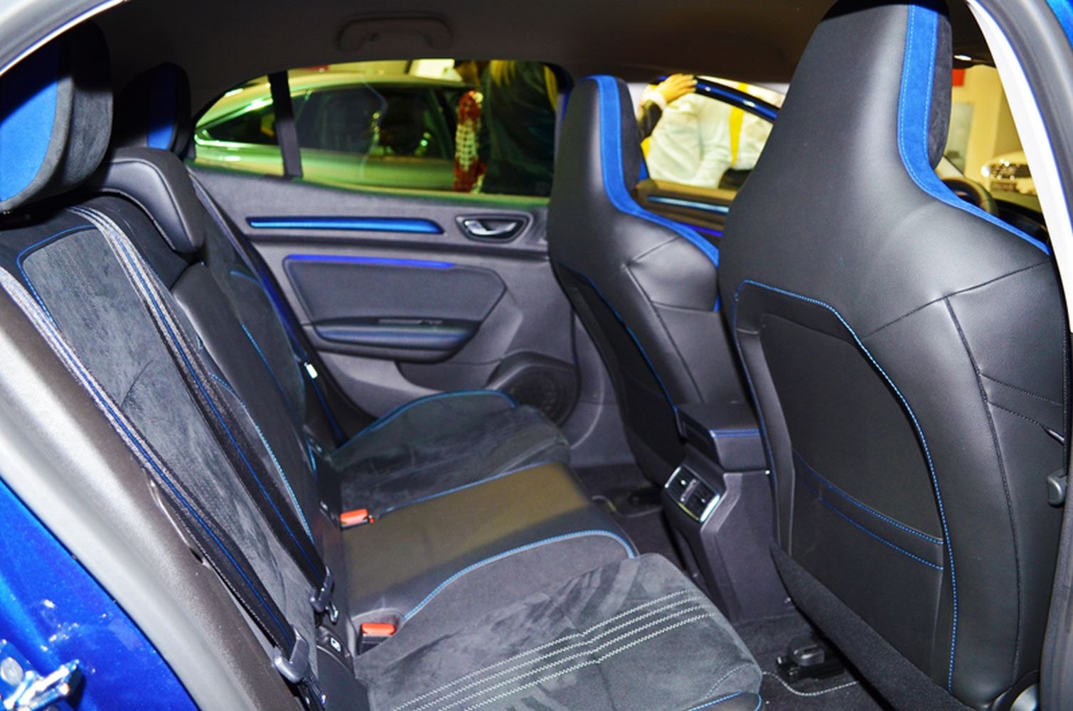 Rear seats with blue-accented upholstery and ergonomic design