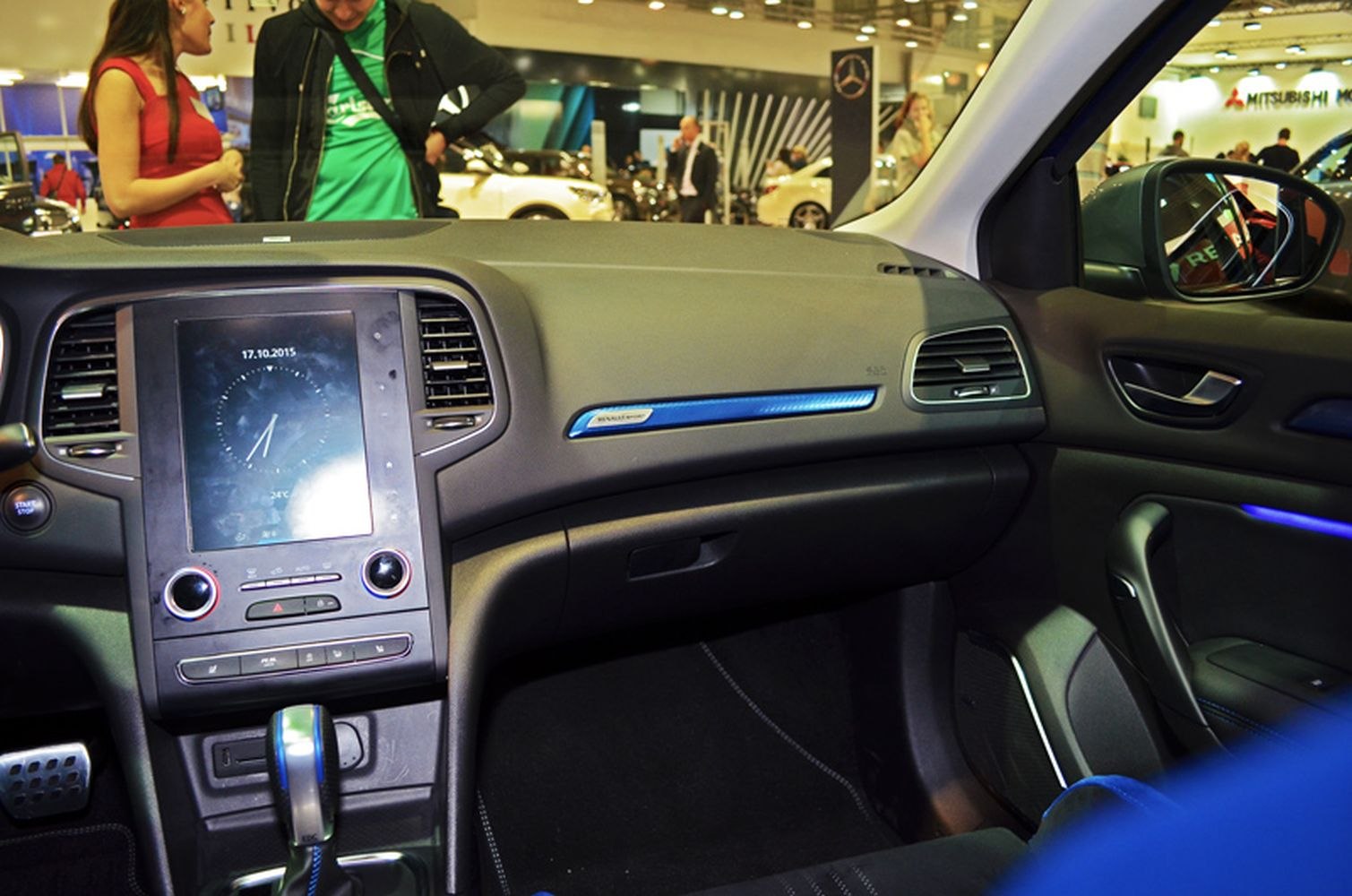 Car interior dashboard with touchscreen and control knobs