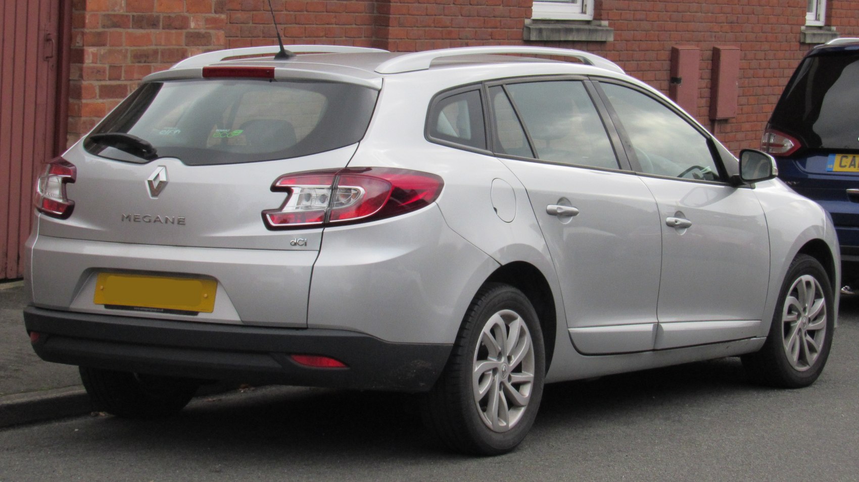 Silver wagon rear and side view with taillights and roof rails