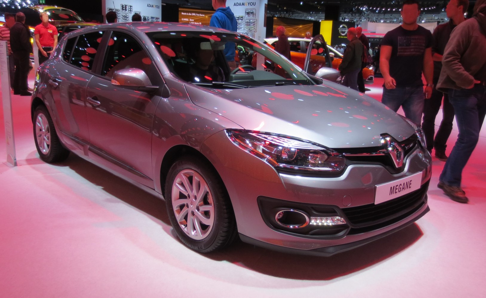 Front view with sleek headlights and aerodynamic hatchback design