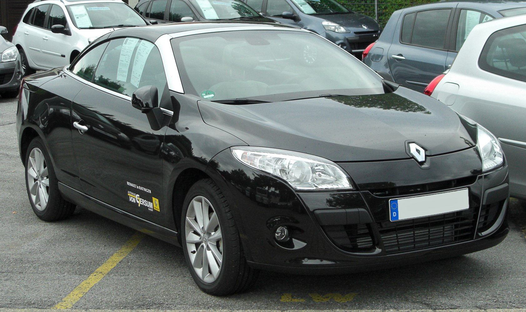 Black convertible car front side view with detailed headlights and alloy wheels