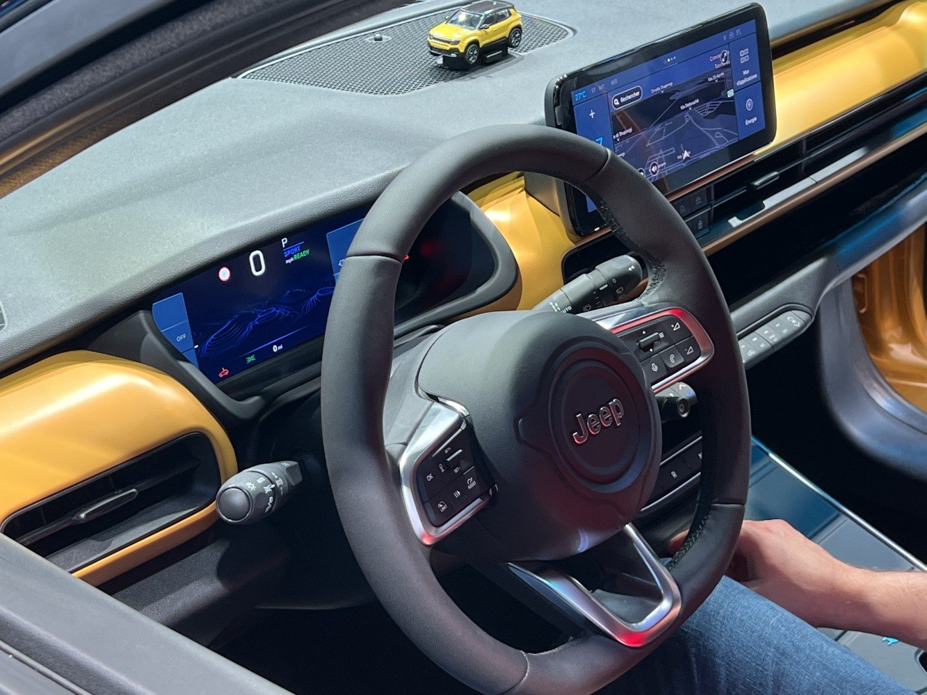 Steering wheel and digital instrument cluster of a modern car interior
