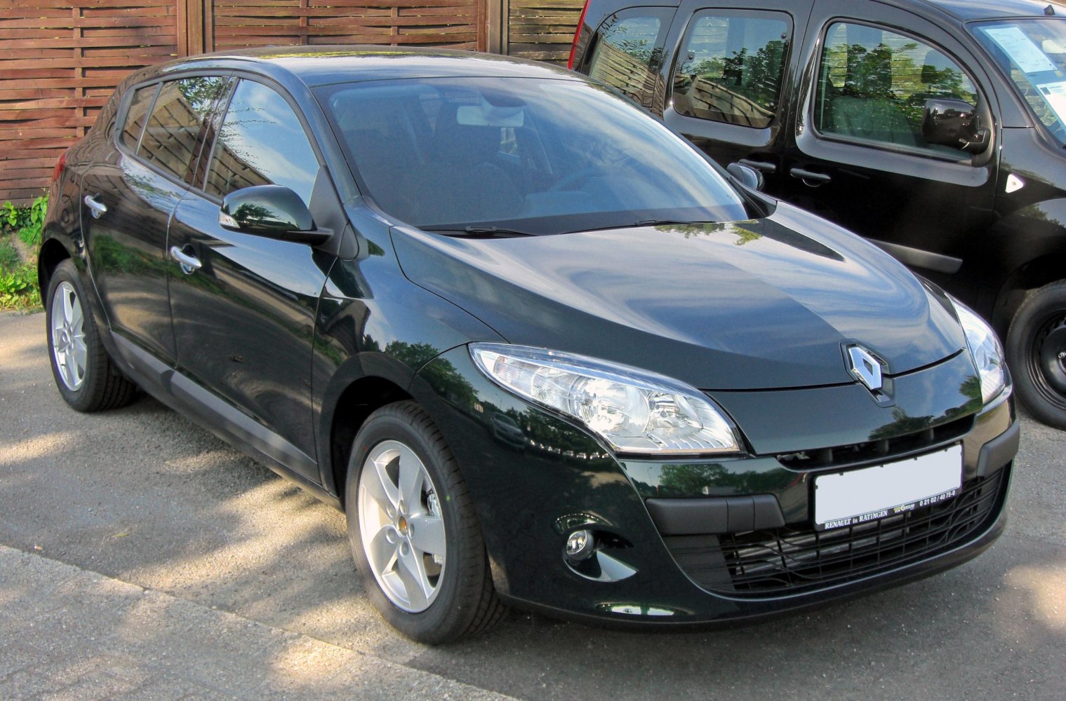 Front-side view of a hatchback with sleek headlights and alloy wheels
