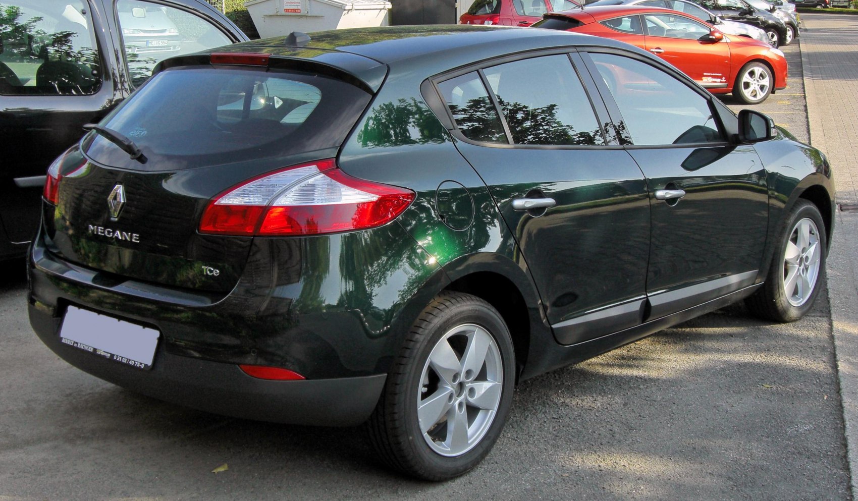 Rear and side profile of a five-door hatchback with TCe badge and alloy wheels