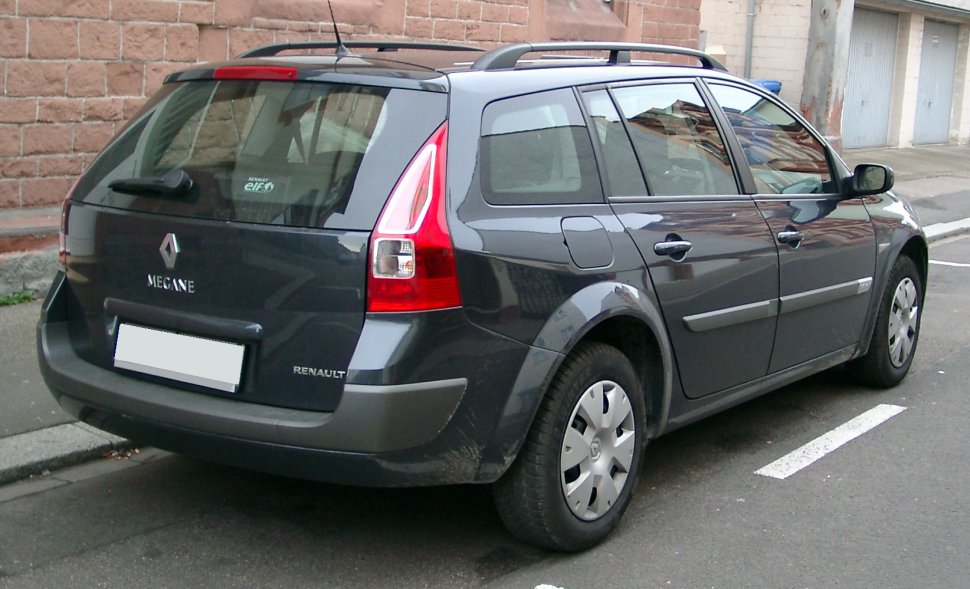 Rear-side view of a station wagon with distinctive vertical tail lights