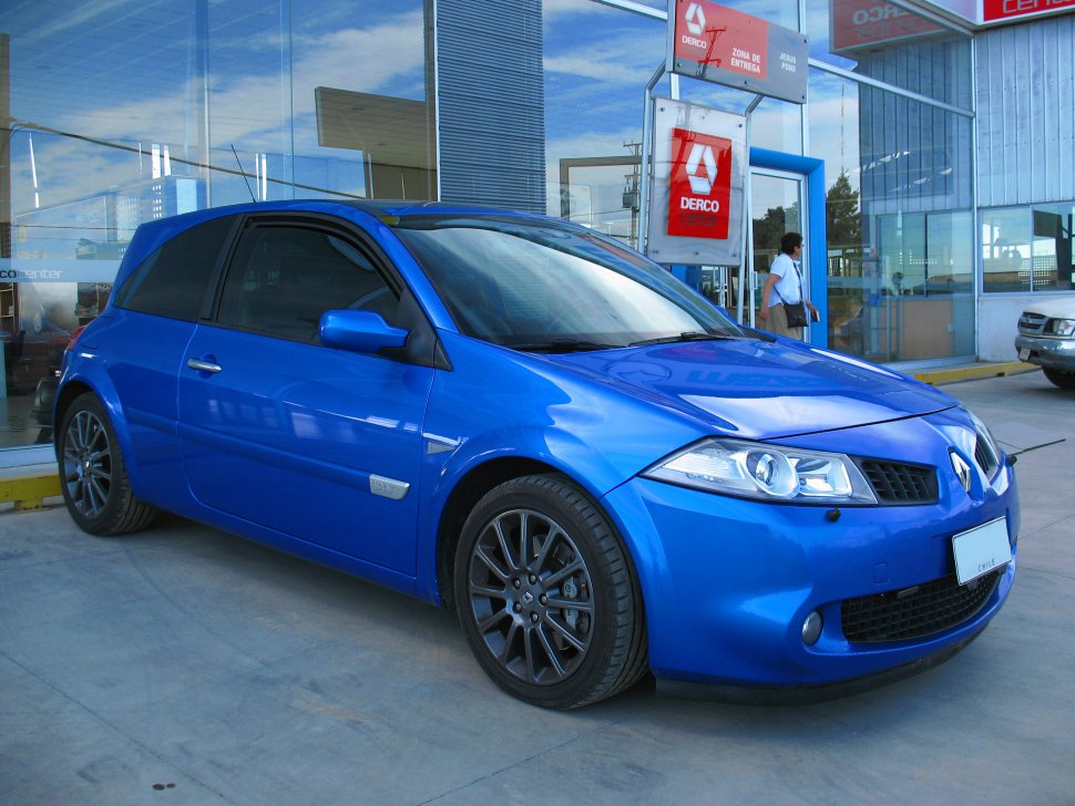 Blue compact hatchback with sporty wheels and modern headlights.