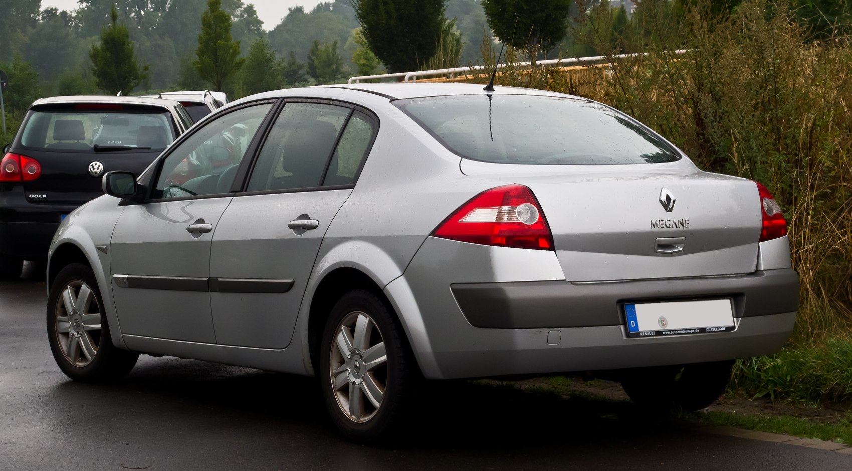 Rear sedan view with distinct taillights and alloy wheels