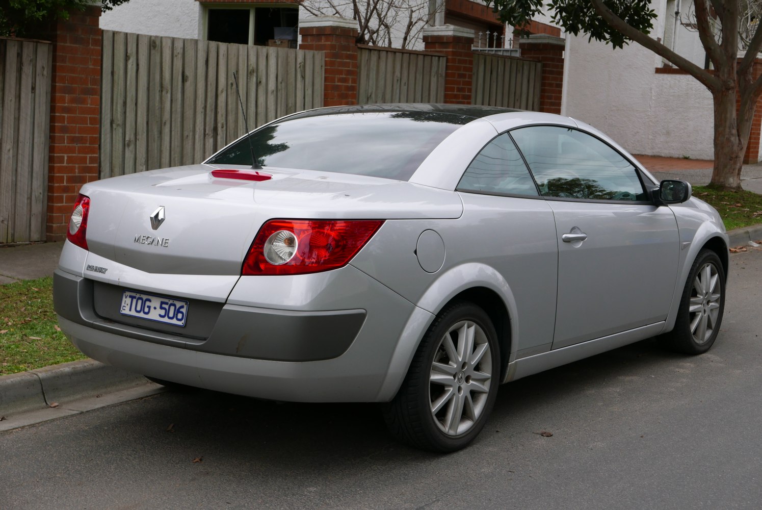 Rear view of silver coupe with alloy wheels and distinctive taillights