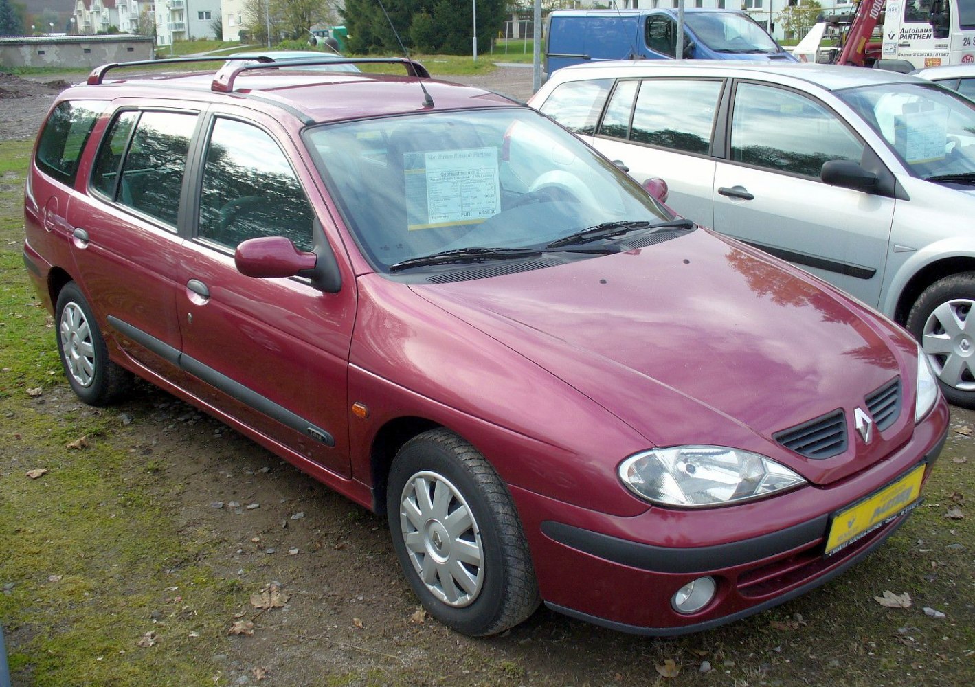 Station wagon with roof rails and distinct front headlights