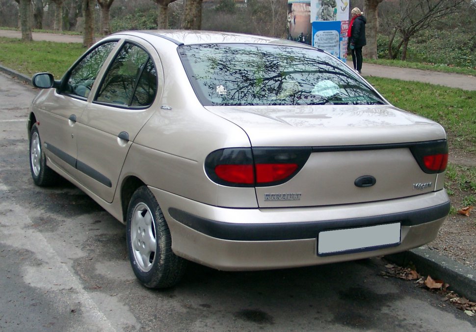 Rear view of sedan with distinct black-bordered red taillights and black bumpers.