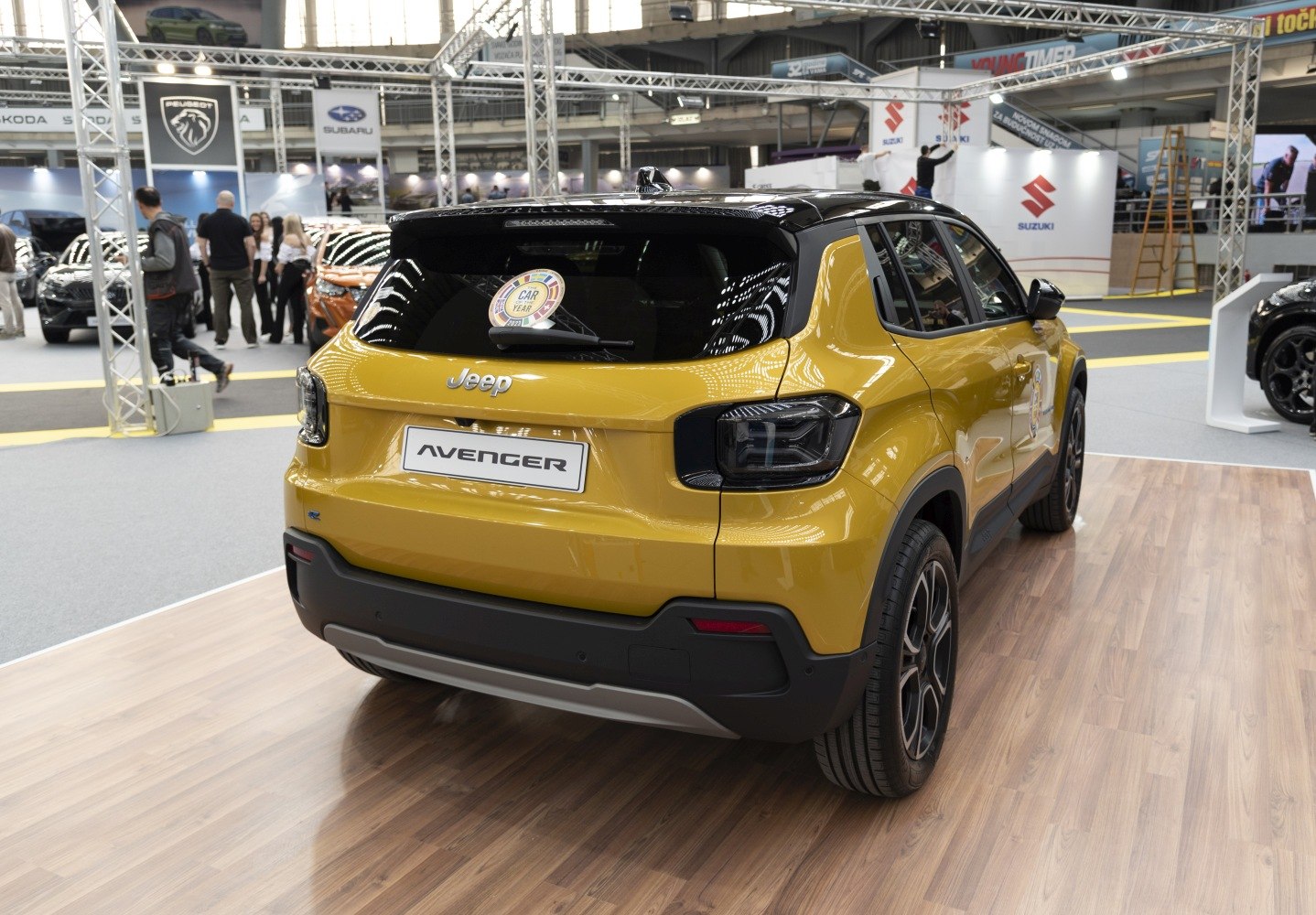 Rear view of an SUV with black roof and distinctive dark tail lights