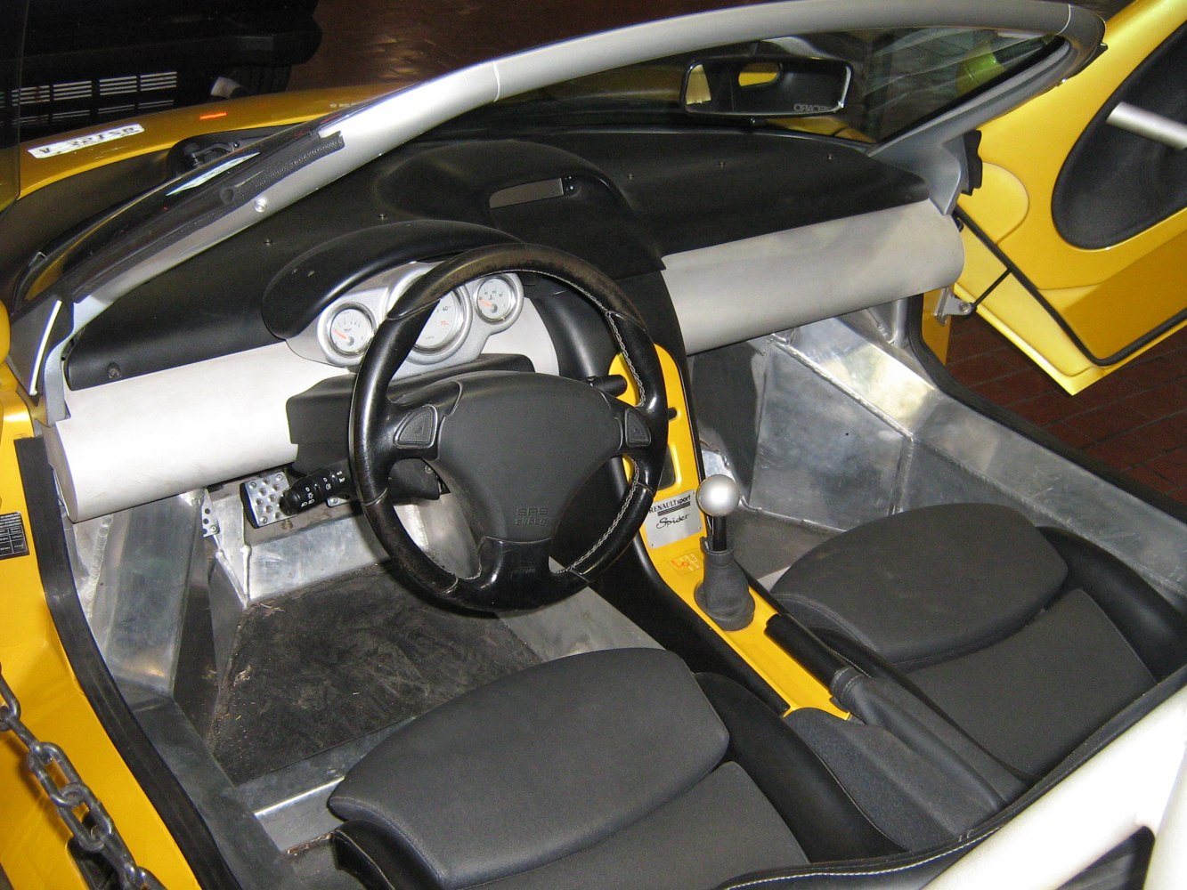 Sporty minimalist interior with manual gear shift and racing seats