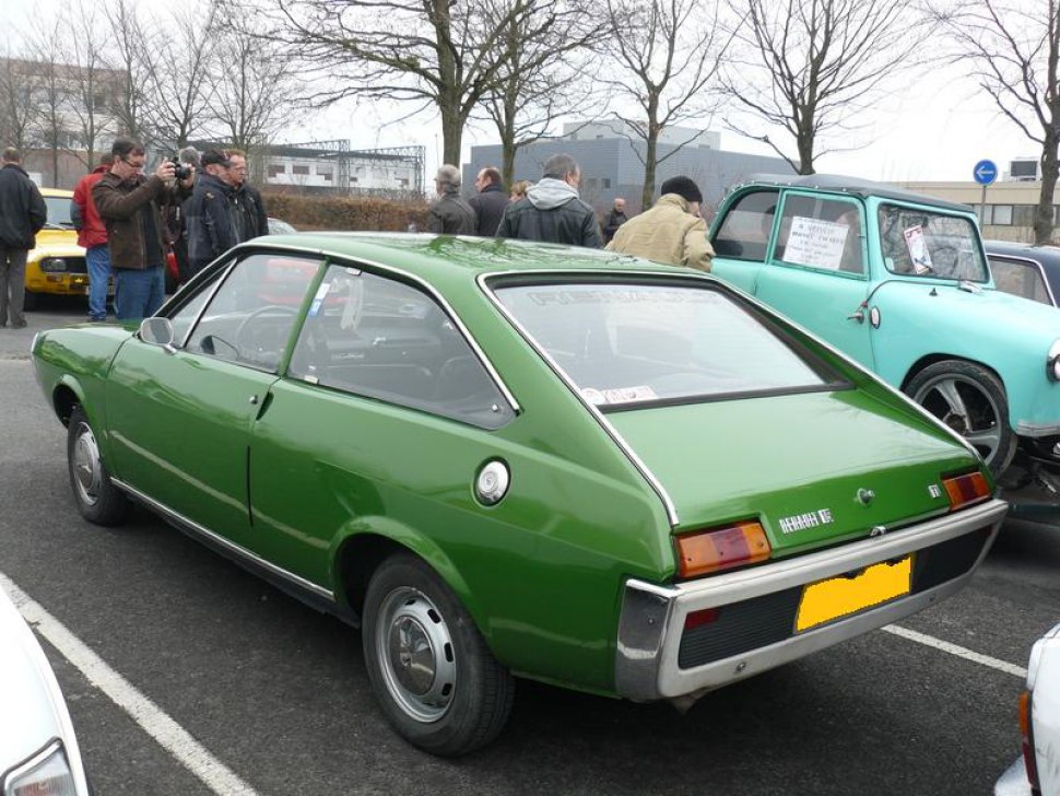 Vintage two-door fastback coupe rear with signature tail lights and rear window.