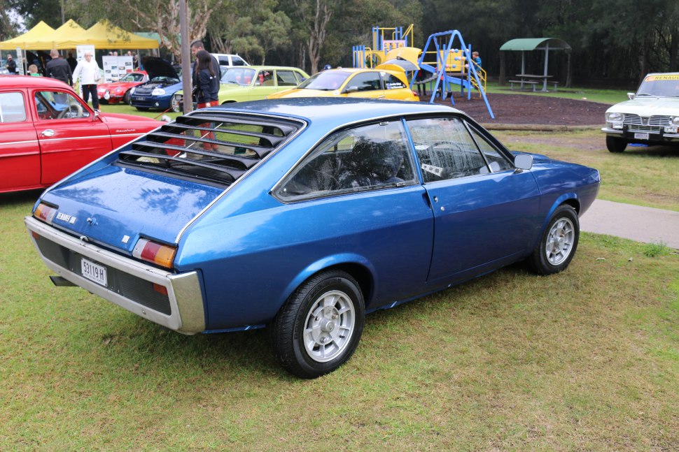 Blue fastback with rear window louvers and alloy wheels