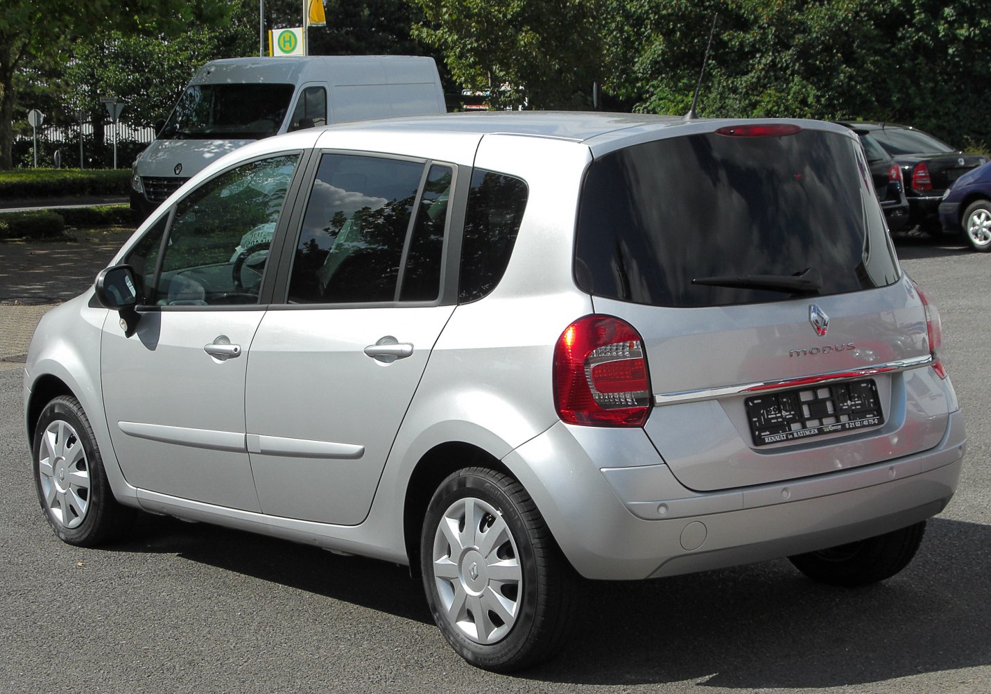 Silver compact hatchback rear side with rounded tail lights