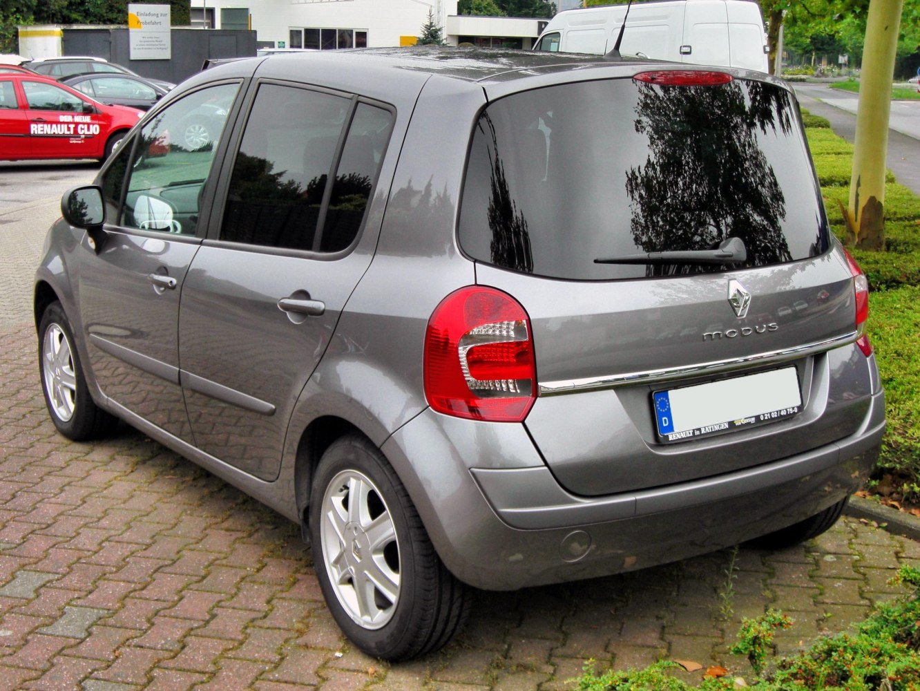 Compact hatchback rear with red tail lights and chrome trim