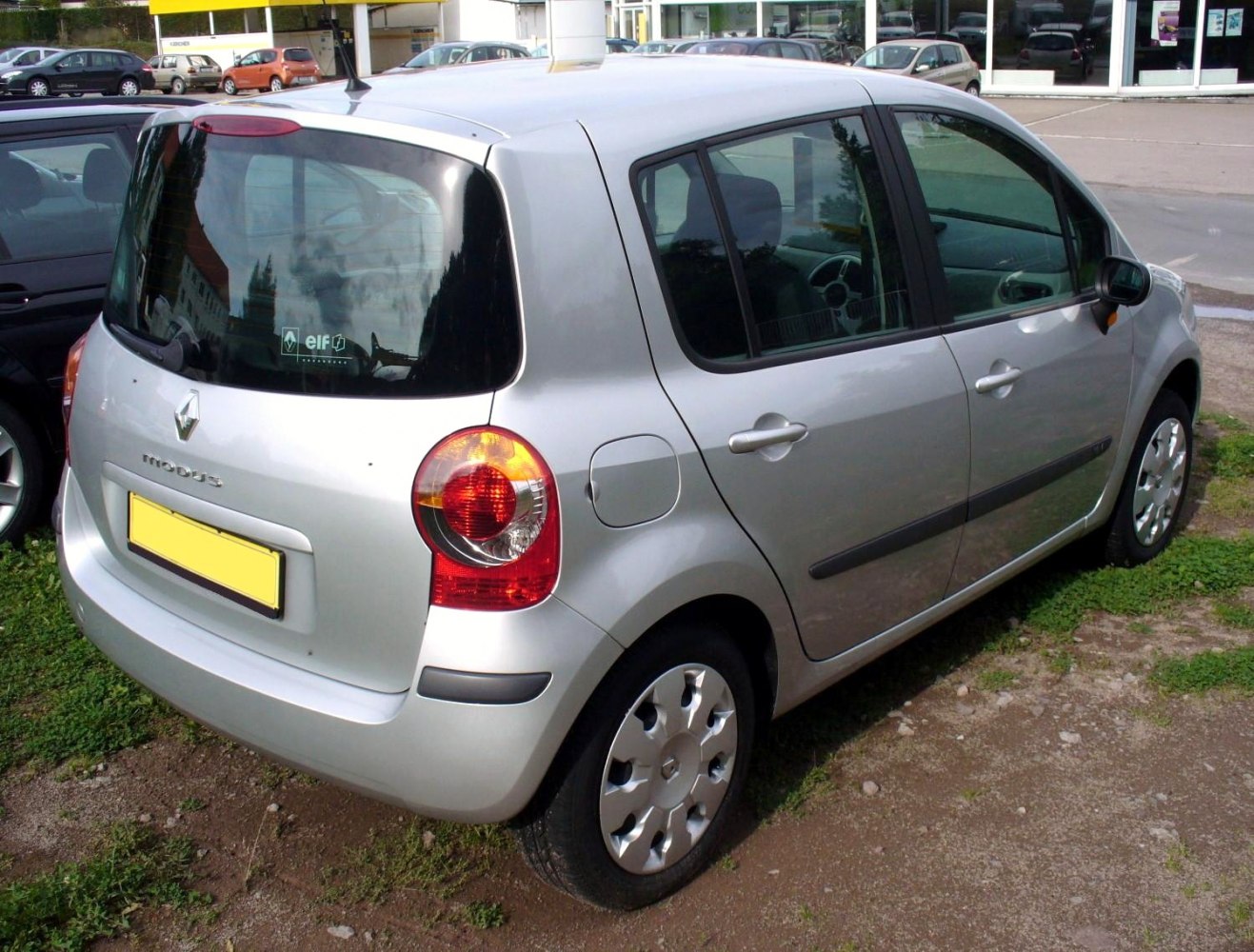 Rear and side view of a compact hatchback with distinctive round taillights and five-door layout