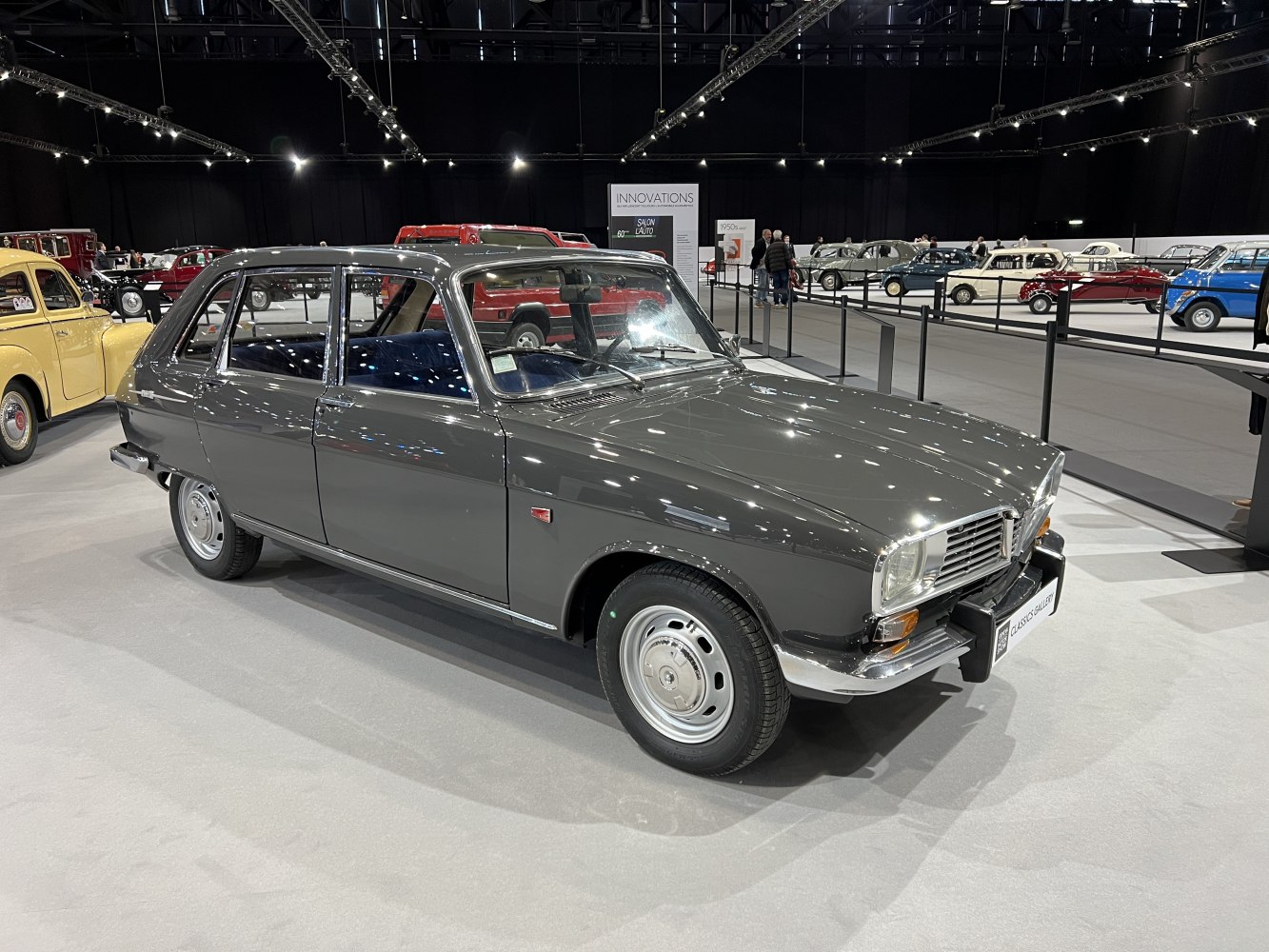Classic 1960s four-door sedan with chrome bumper and distinctive front grille.