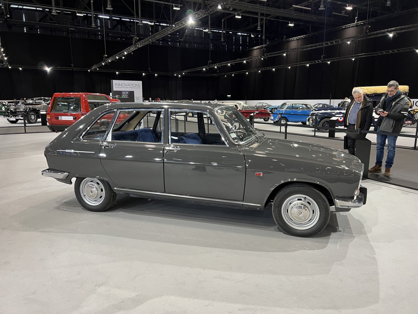 Side view of vintage hatchback with steel wheels and chrome bumpers