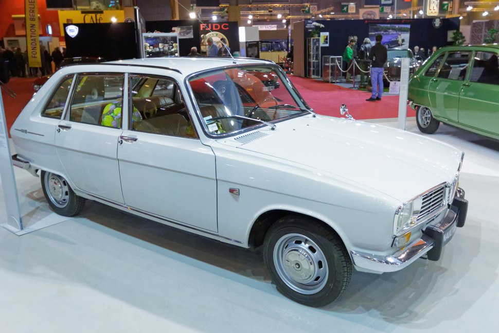 Vintage white sedan with chrome details and steel wheels