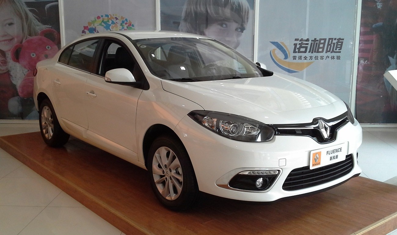 White sedan with updated front grille and headlights