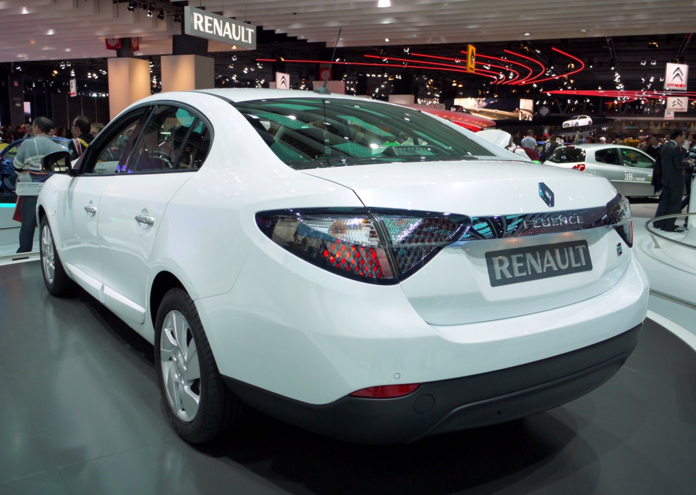 Rear view of white electric sedan with distinct tail lights