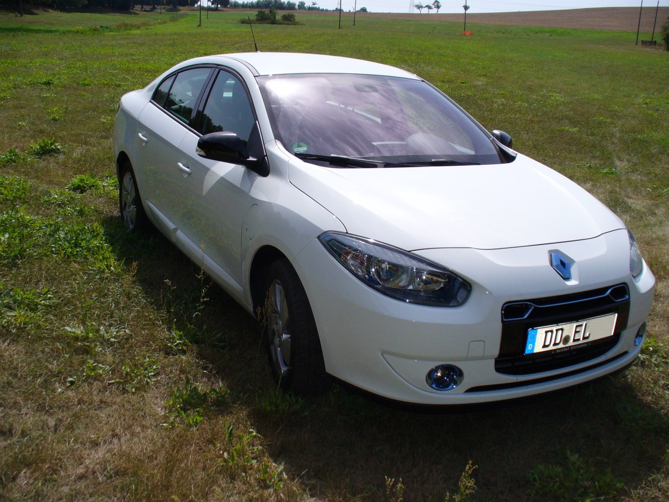 White sedan with aerodynamic front and clear headlights