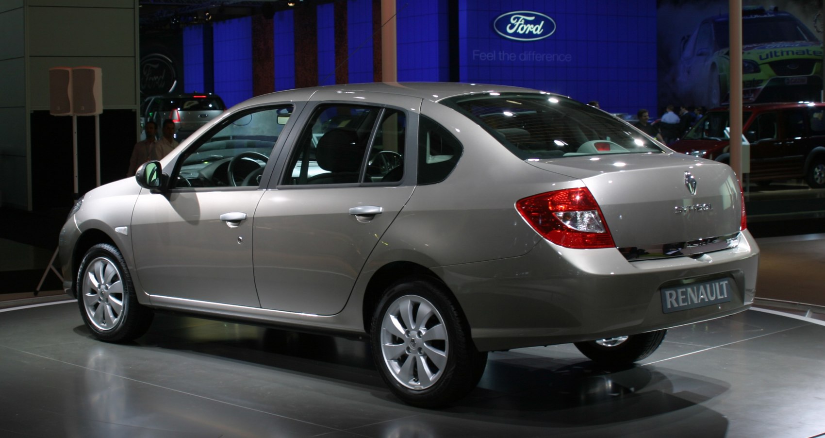 Silver sedan rear side with alloy wheels