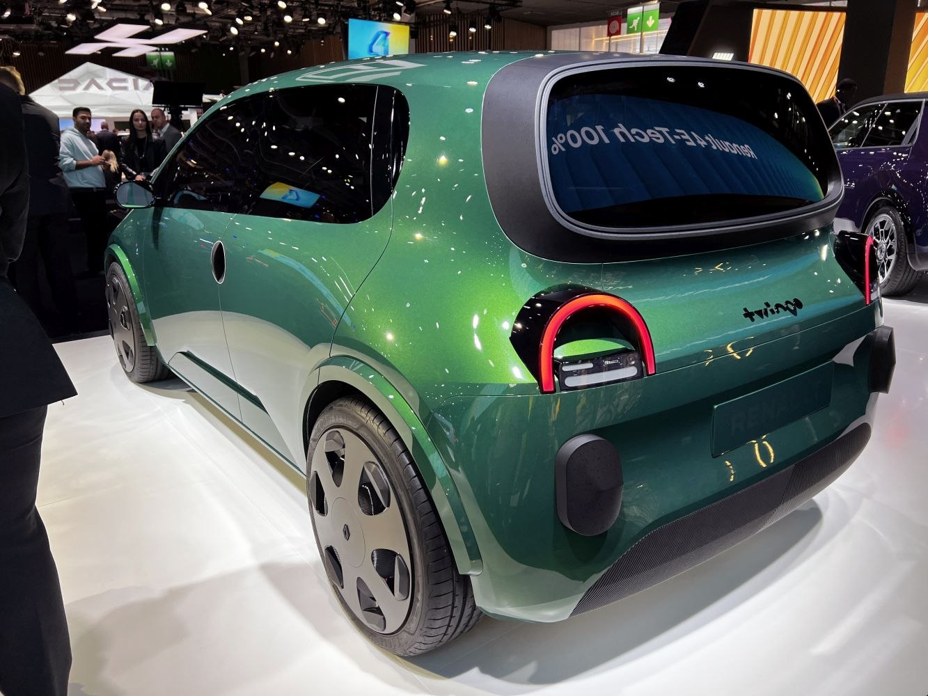 Rear view of electric compact hatchback with unique taillights and smooth design.