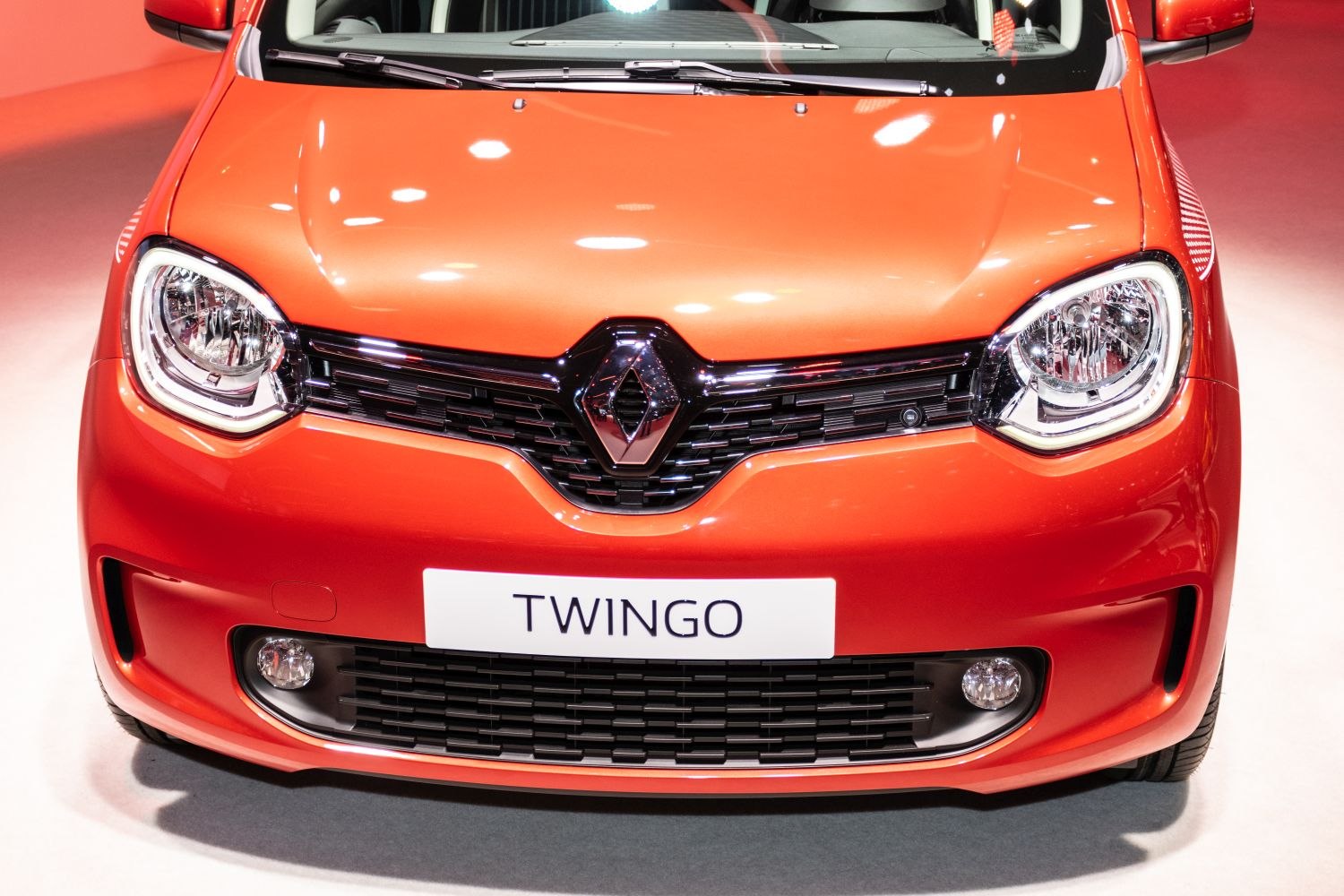 Close-up of front grille, headlights, and fog lights on a compact car