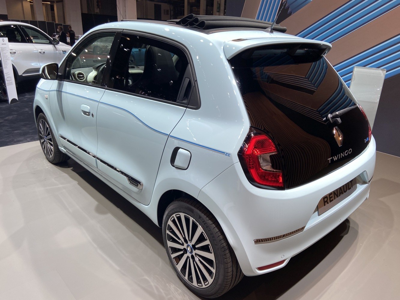 Rear side profile of a compact five-door hatchback with distinctive taillights and modern alloy wheels.