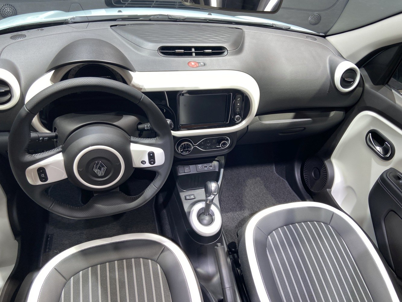 Modern dashboard and multifunction steering wheel seen from driver seat
