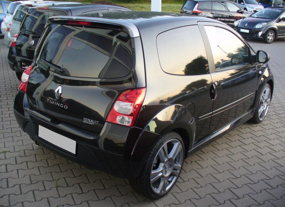 Rear and side view of a compact hatchback with tinted windows and sporty wheels.