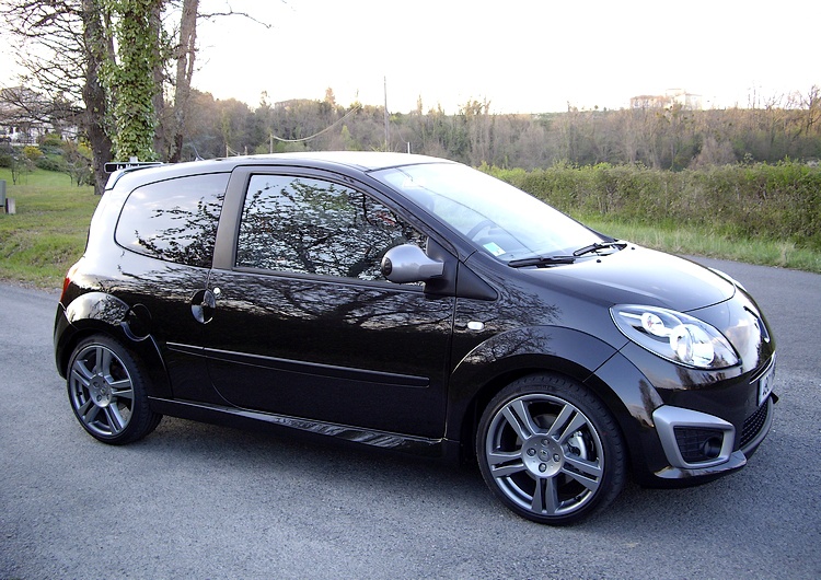 Compact black hatchback with sporty alloy wheels and tinted windows