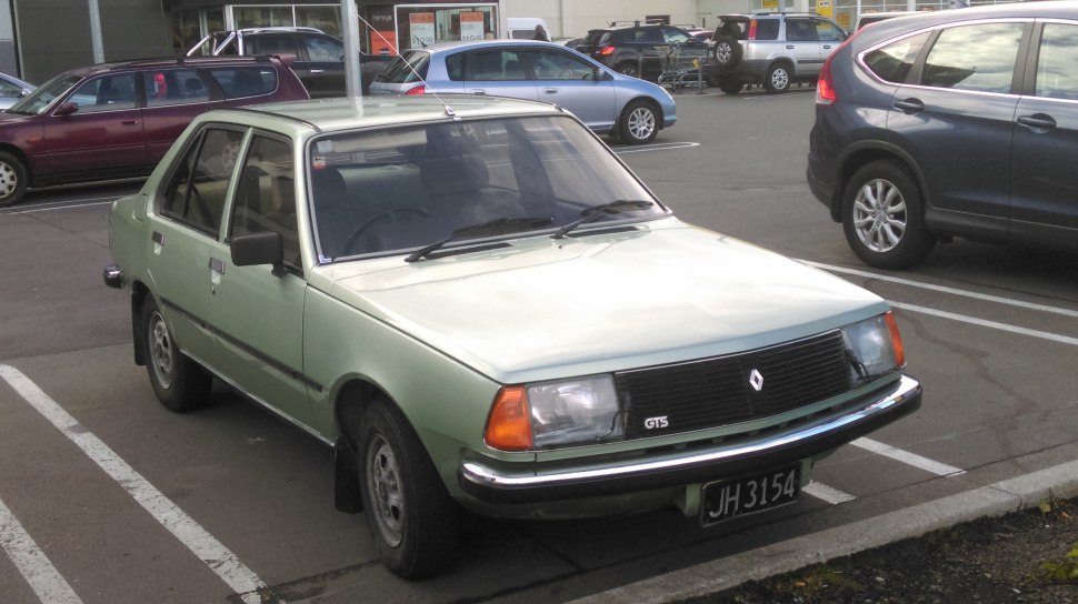Front angle view of vintage four-door sedan with GTS badge