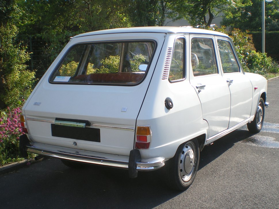 Vintage hatchback with distinct rear window and tail light design.