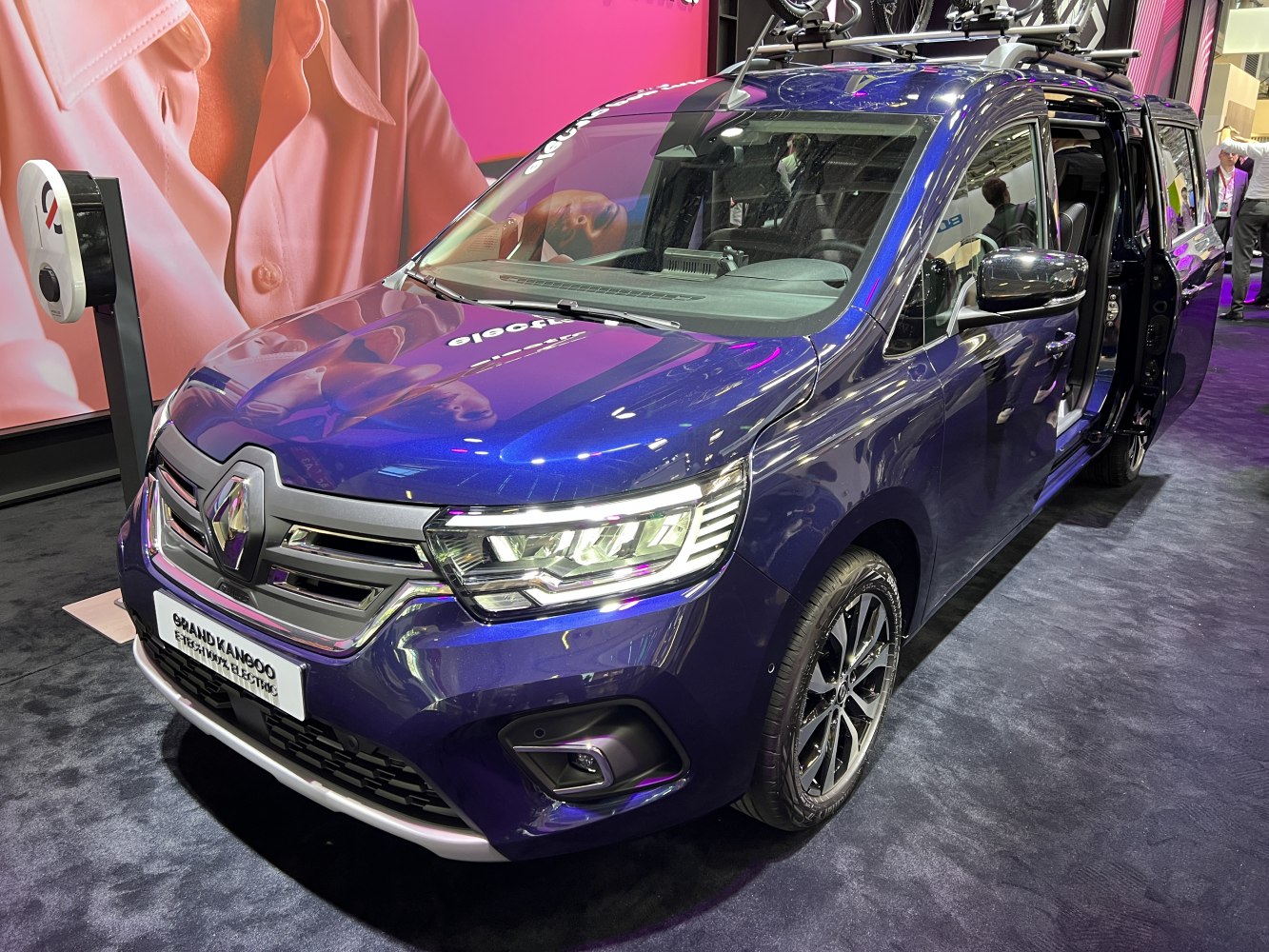 Electric vehicle with modern LED headlights and sliding rear door