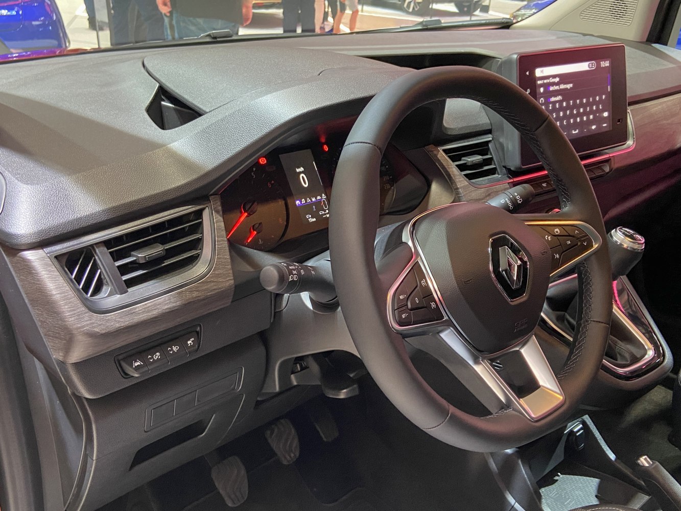 Modern car interior with dashboard, steering wheel, and infotainment screen