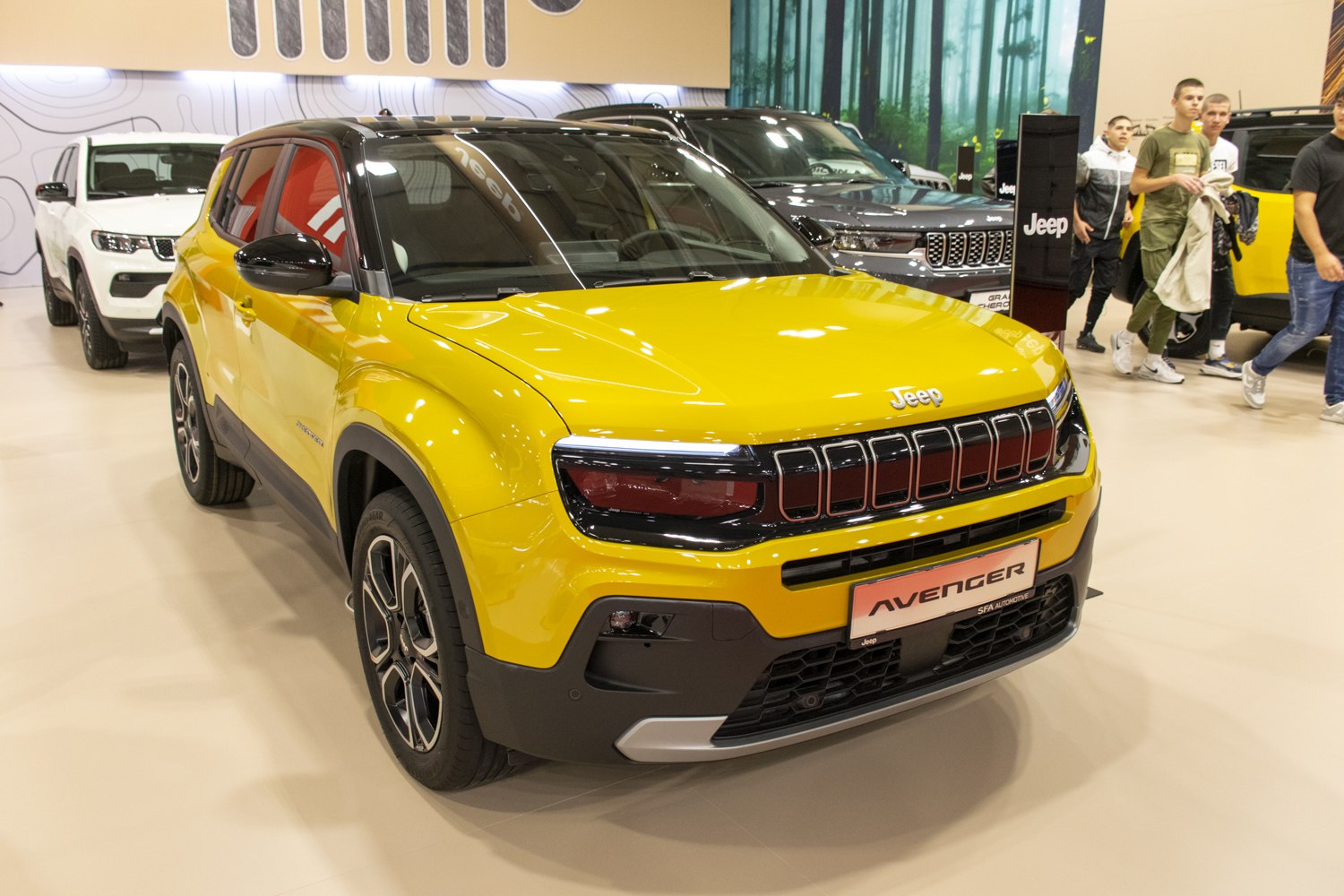 Front view of a yellow compact SUV with modern grille and headlights.